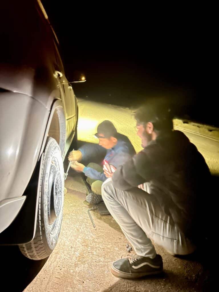 Car tire replaced in the dessert in Africa