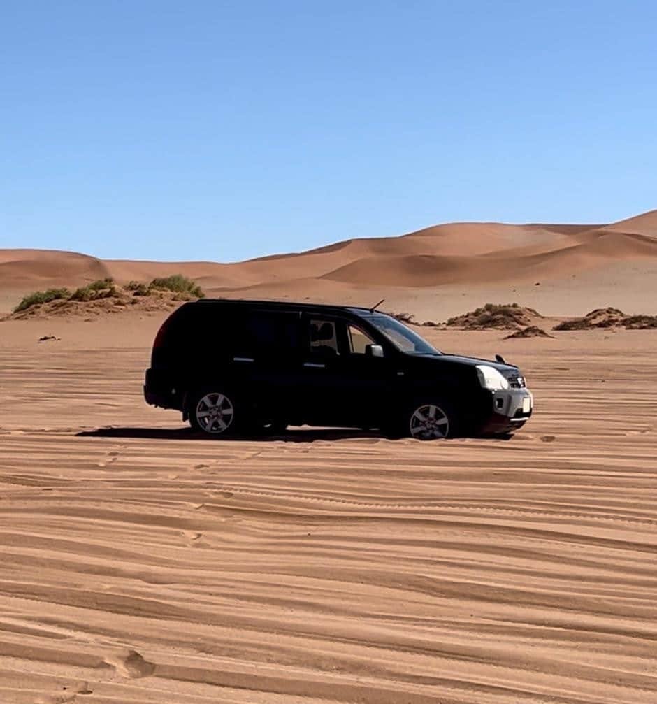 Car stuck in desert in Namibia